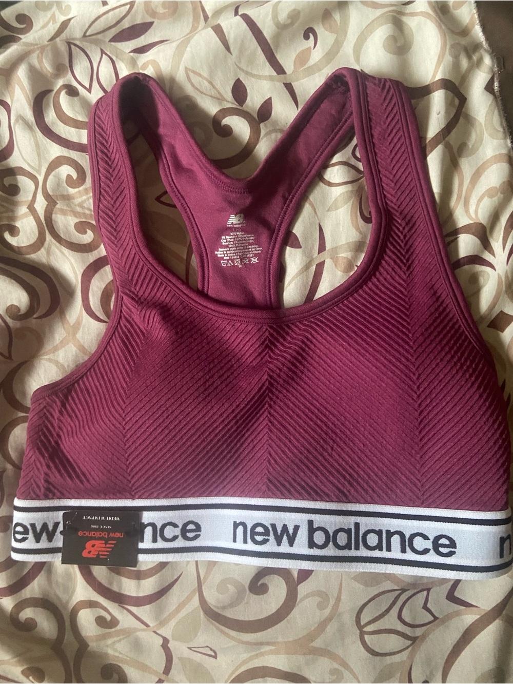 New Balance Women's Burgundy Sports Bra with White Logo Band
